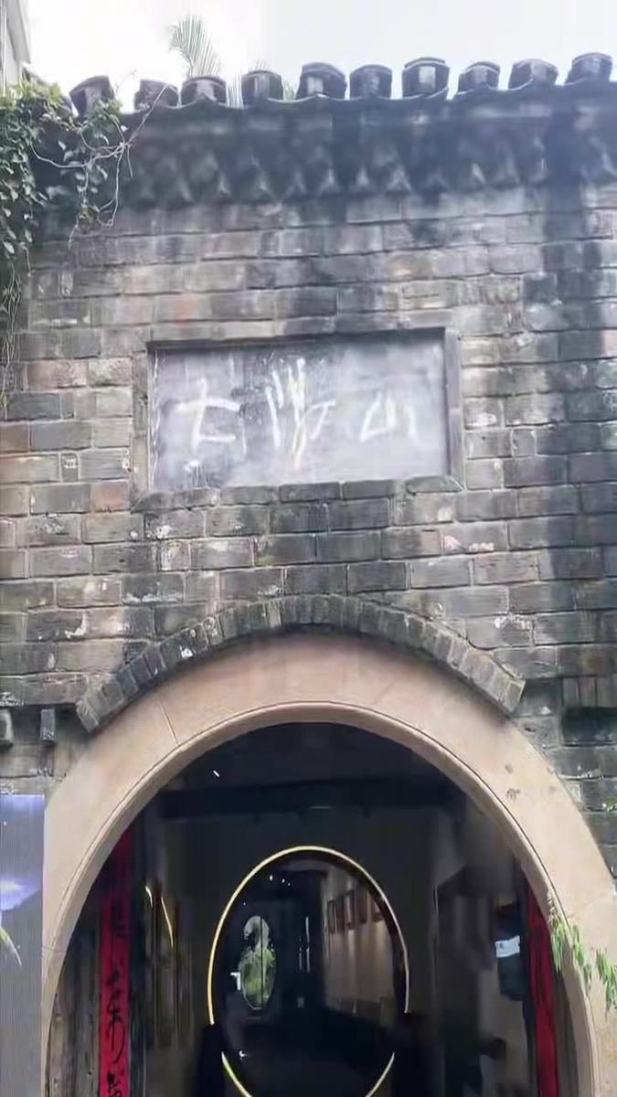 Documentary frame — old Dafen building