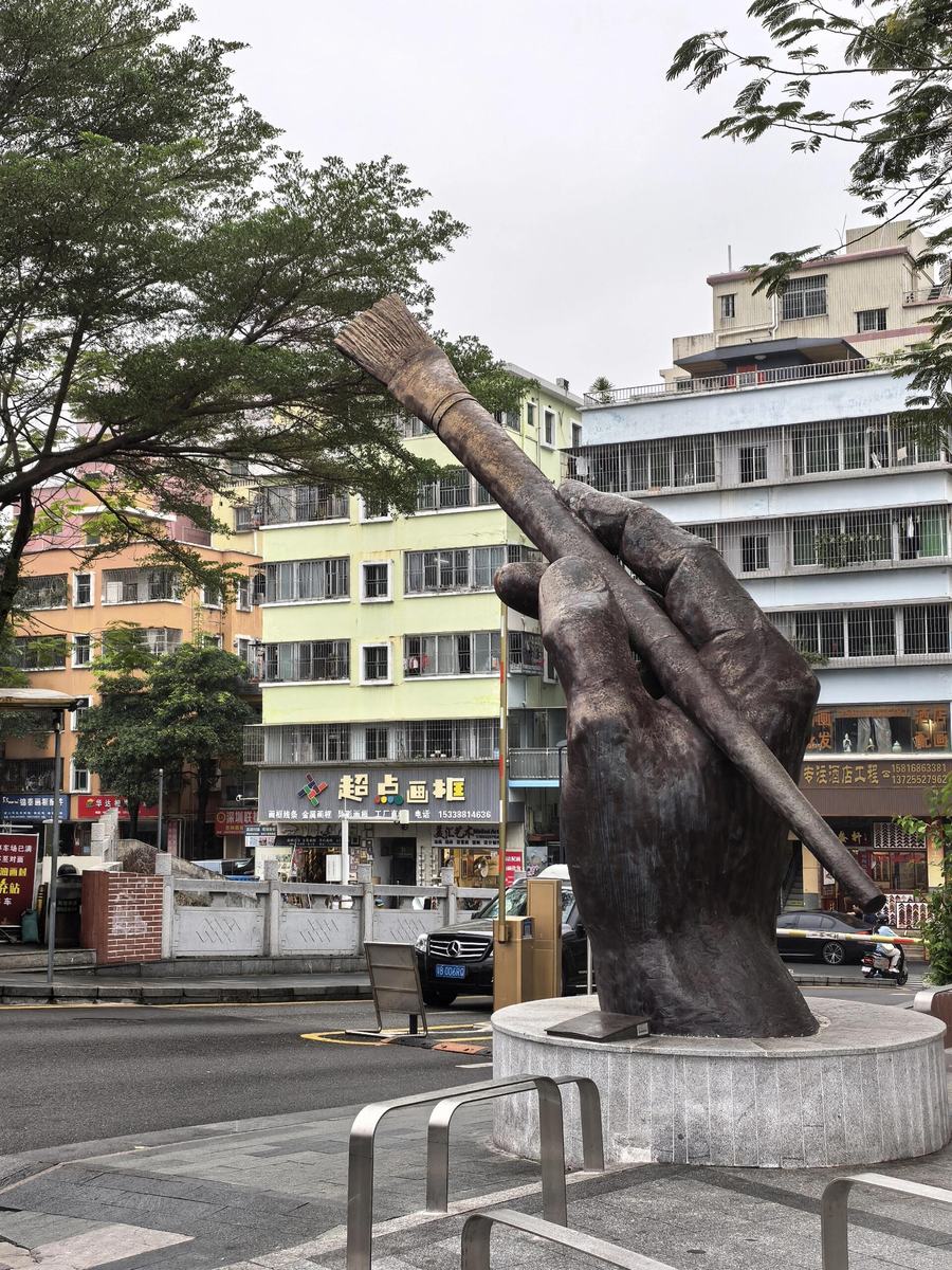 Giant paintbrush sculpture in Dafen