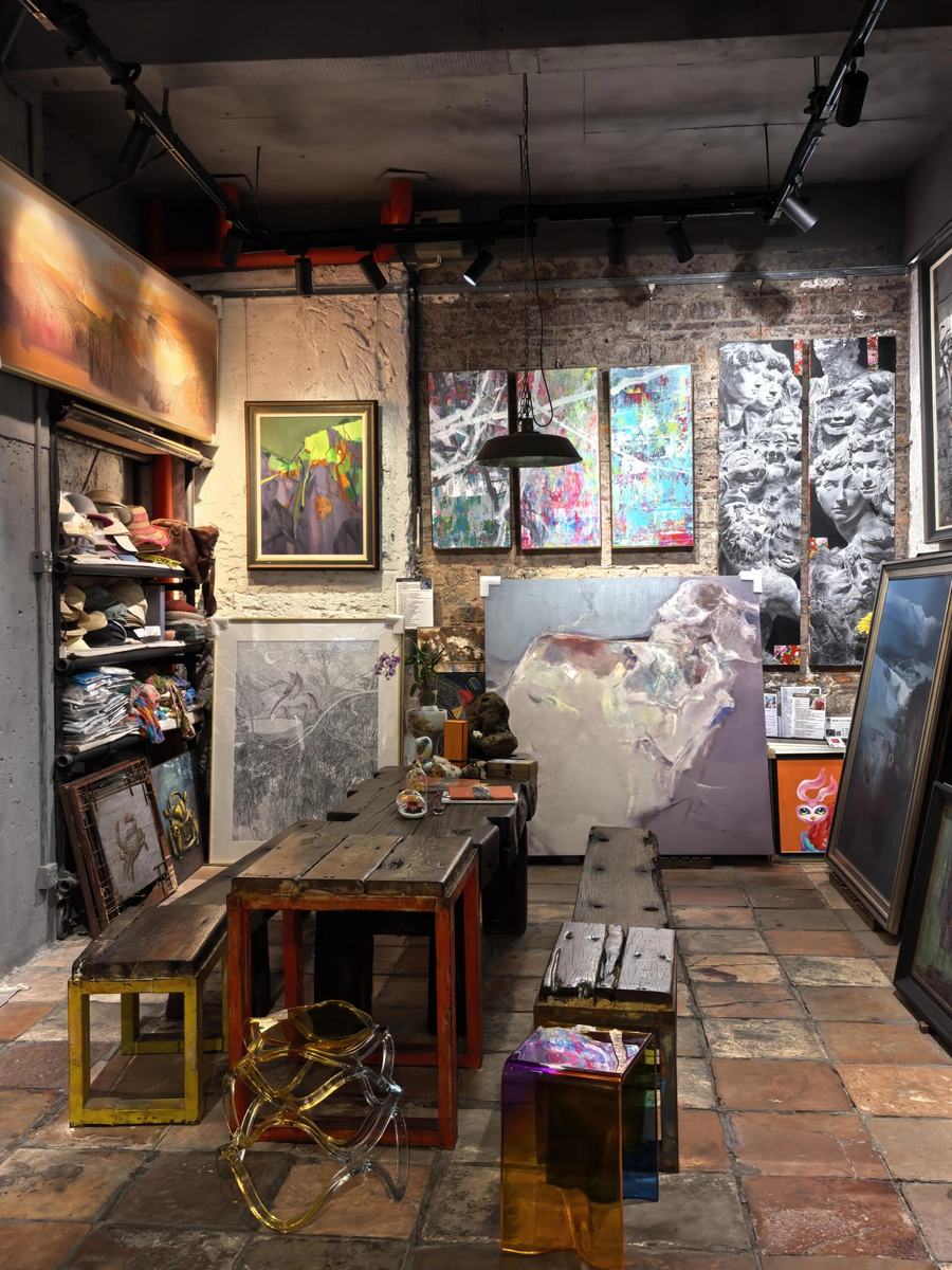 Abstract painting and palette inside a Dafen gallery