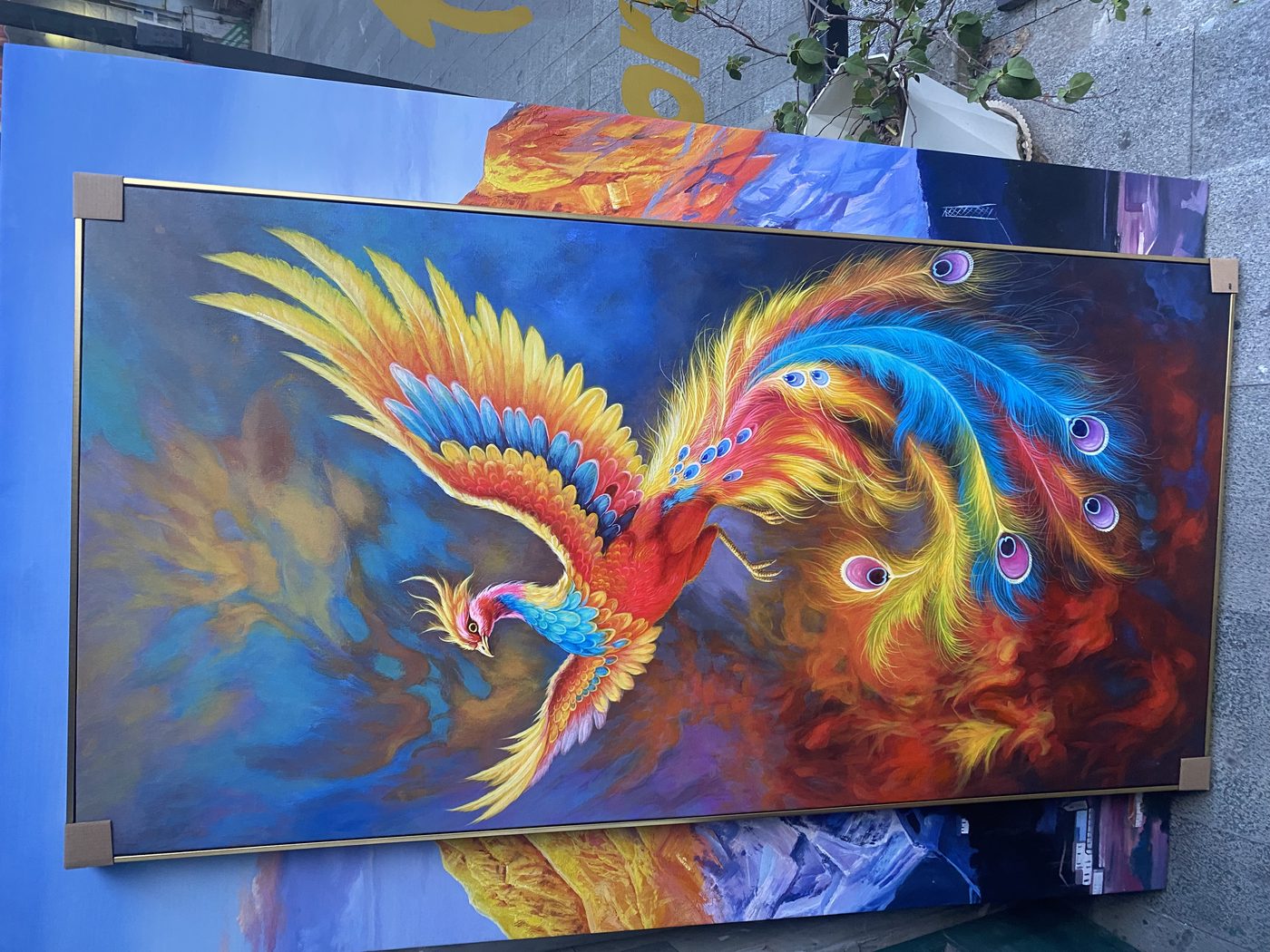 Large custom phoenix oil painting displayed in studio