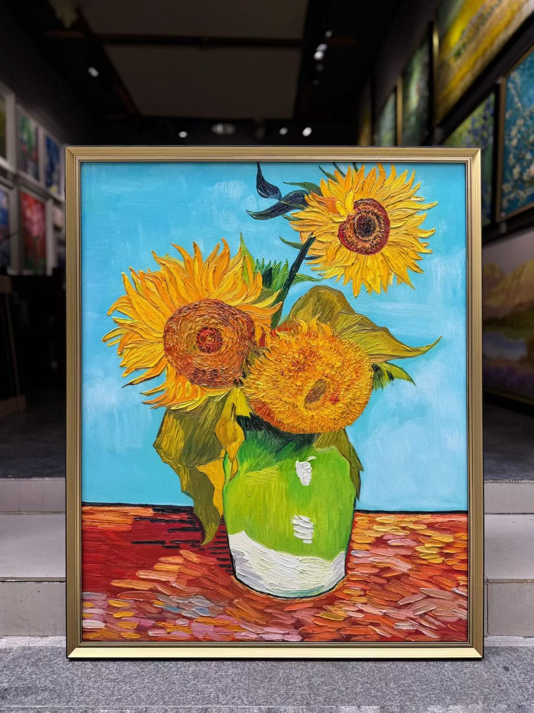 Hand-painted Van Gogh Three Sunflowers reproduction in a gold frame against a blue background